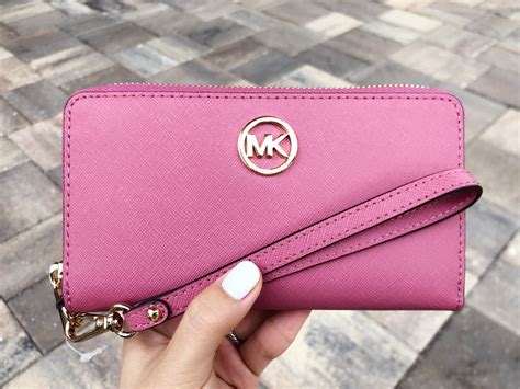 pink and black michael kors wristlet|michael kors slim wallet black.